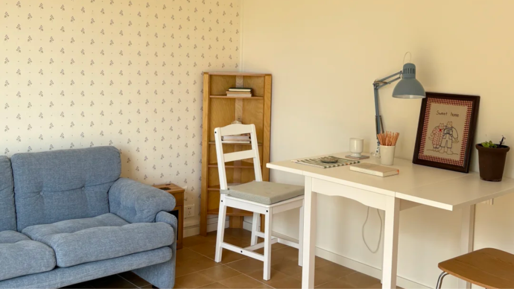 Small removable wallpaper test patch on a painted rental wall
