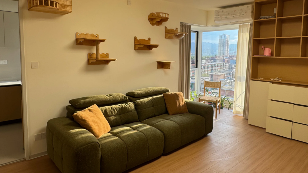 Dated furnished rental sofa with bulky shape and patterned upholstery