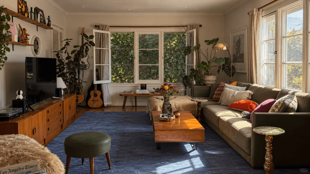 Dark rental furniture separated by visible floor and open space