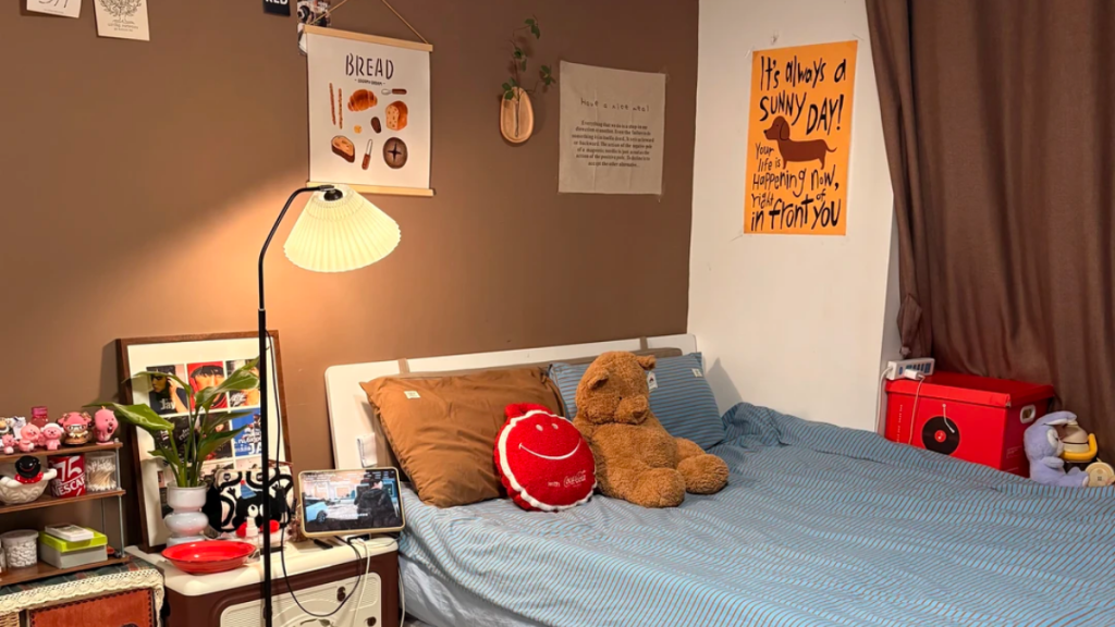 Bedding adding visual contrast against beige rental walls