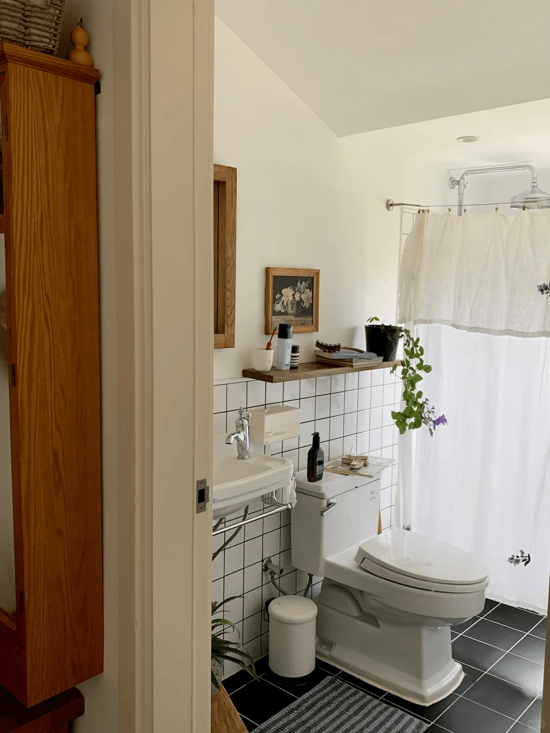 Small rental bathroom with simple tile and shower